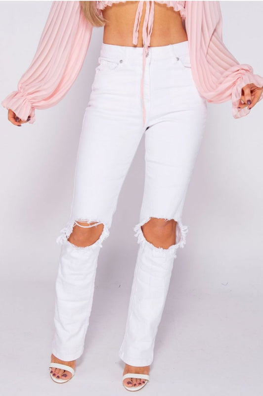 White high-waisted trousers with rips