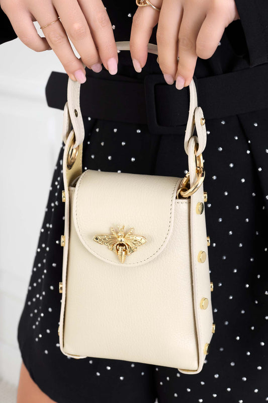 Beige handbag with gold studs and removable shoulder strap