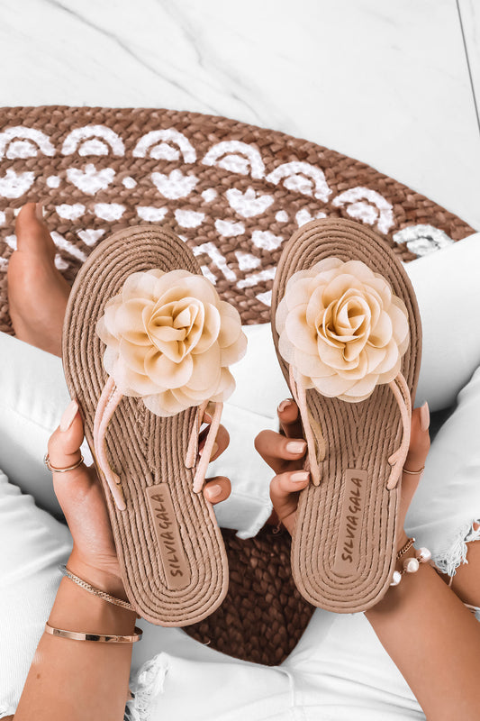 Beige slide sandals with applied flower