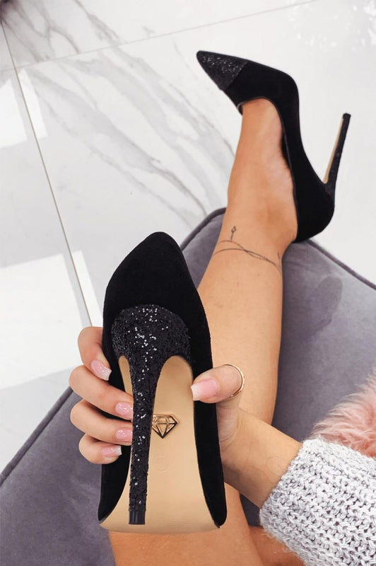 Black pumps with heel and glittered toe