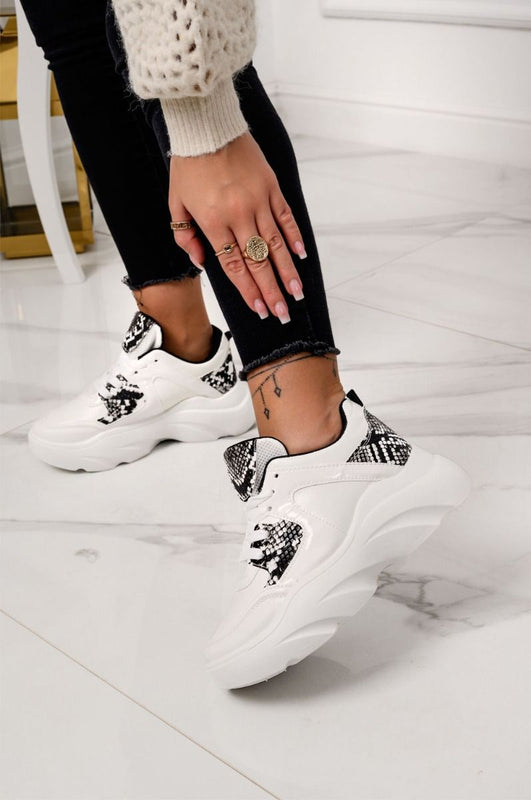 White sneakers with python-effect inserts and laces