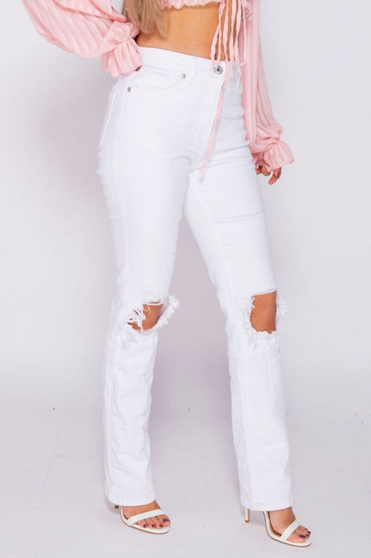 White high-waisted trousers with rips