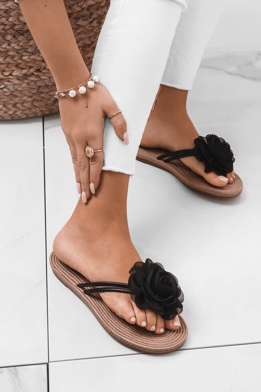 Black slide sandals with applied flower