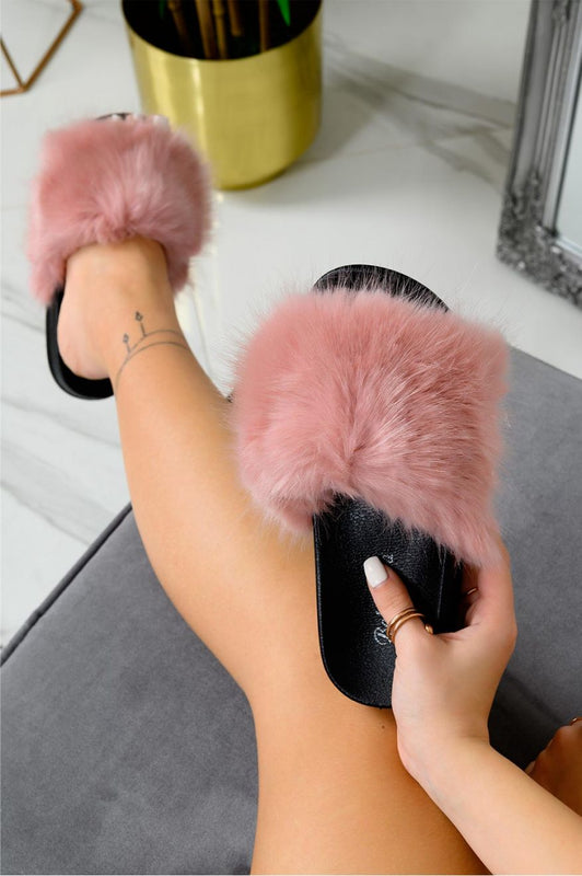 Pink slip-on sandals with faux fur