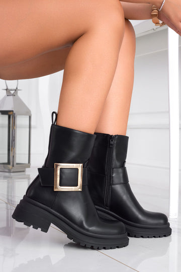 Black ankle boots with gold buckle