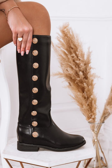 Black boots with gold buttons and internal wedge